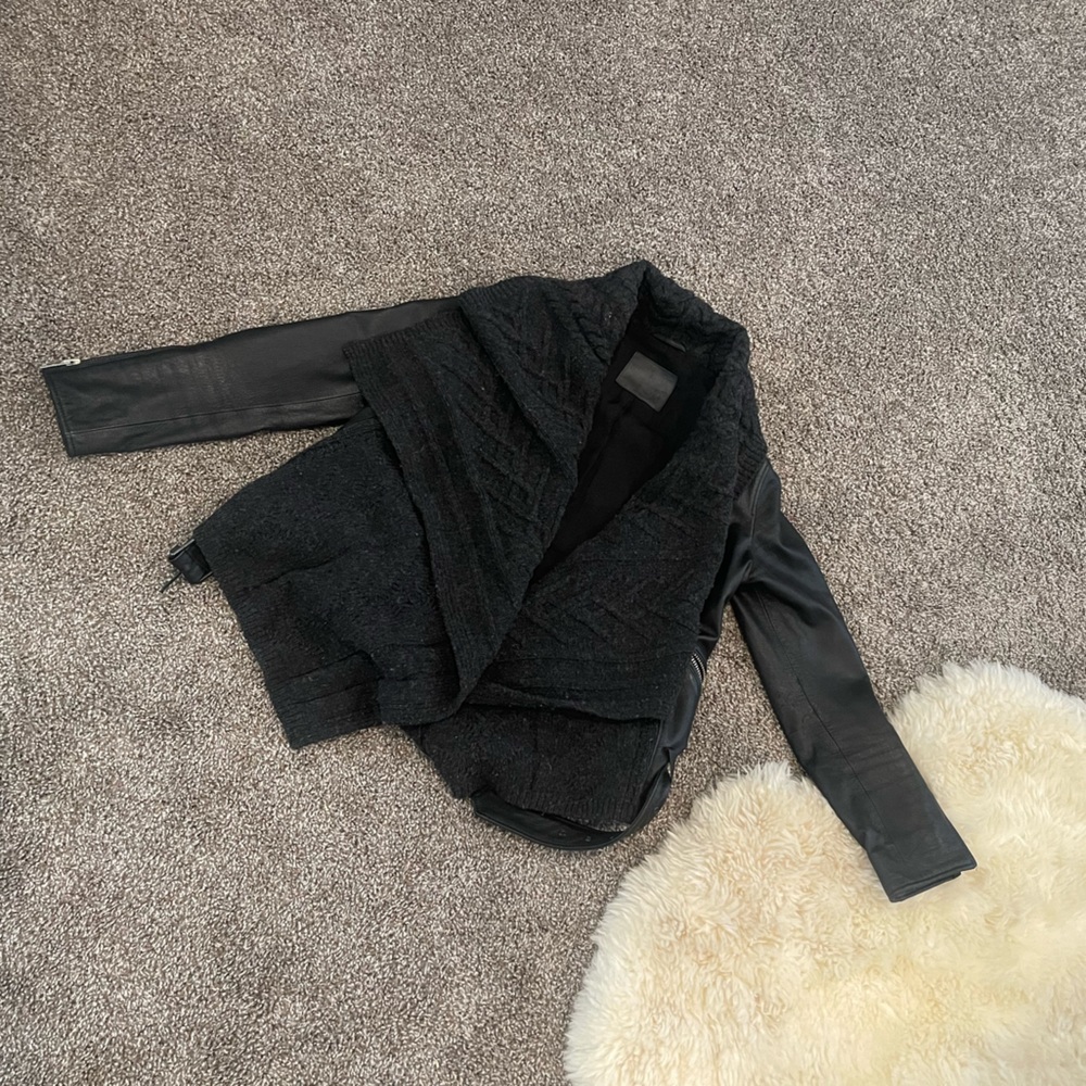 This jacket is amazing! Basically brand new! It has this amazing wool knit